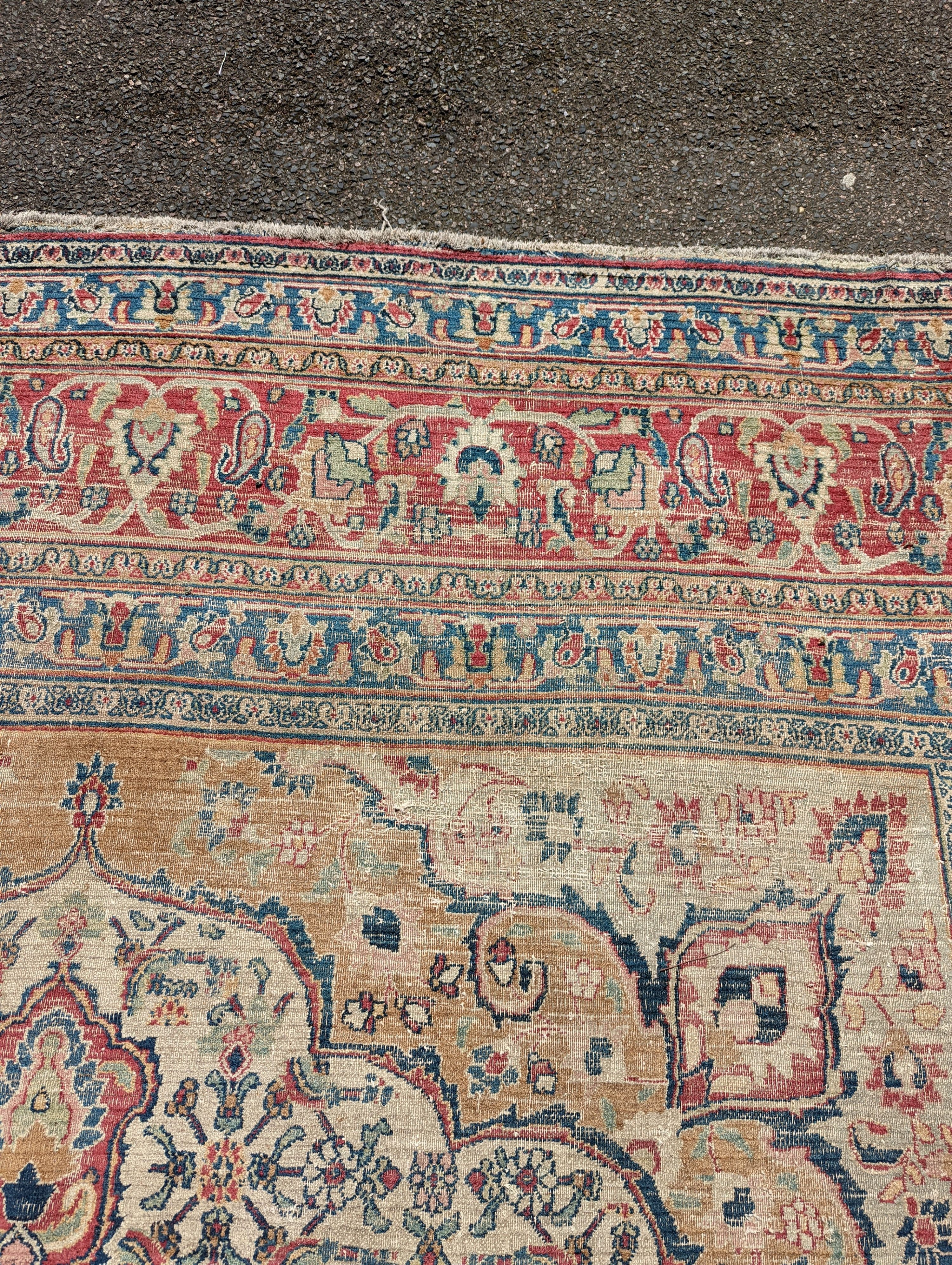 An Isfahan ivory ground carpet, 432 x 330cm